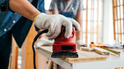 Close-up,Hand,Of,An,Asian,Father,And,Son,Carpentry,Sanding
