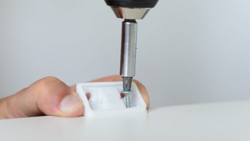Worker,Fastens,Detail,When,Assembling,White,Furniture