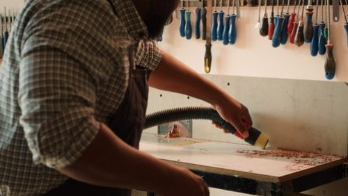 African,American,Woodworker,Cleaning,Spindle,Moulder,Machine,After,Finishing,Client