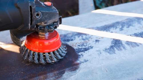 The,Builder,Works,With,An,Angle,Grinder.,Wire,Cleaning,Brush.