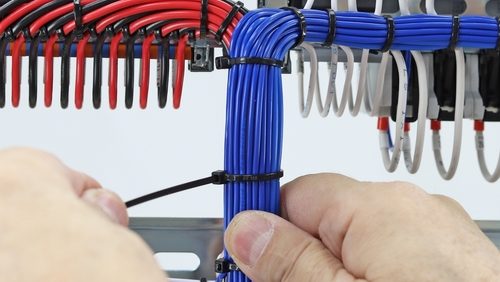 Installation,Of,A,Cable,Tie,On,An,Insulated,Mounting,Wire